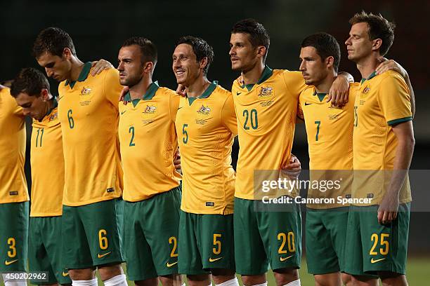 Socceroo players sing the Australian national anthem during the International Friendly match between Croatia and the Australian Socceroos at Pituacu...