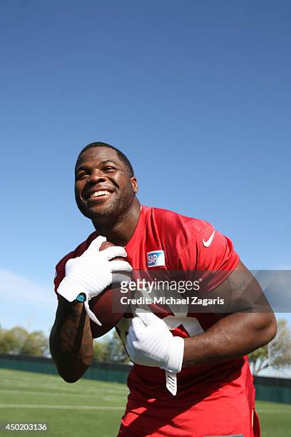 Carlos Hyde of the San Francisco 49ers clowns around during the 49ers Rookie Minicamp on May 23, 2014 in Santa Clara, California.