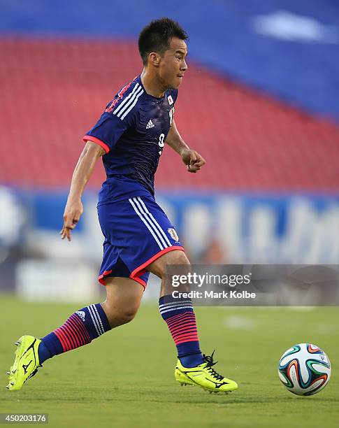 Shinji Okazaki of Japan runs with the ball during the International Friendly Match between Japan and Zambia at Raymond James Stadium on June 6, 2014...