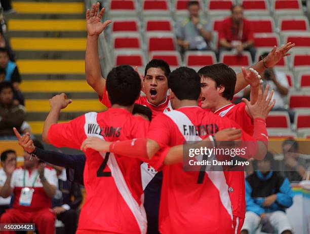 Players of Peru celebrate during a match against Chile in Volleyball event as part of the XVII Bolivarian Games Trujillo 2013 at Gran Chim Stadium...