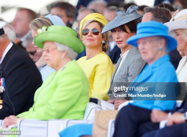 Queen Maxima of The Netherlands and Samantha Cameron sit behind Queen Elizabeth II and Queen Margrethe of Denmark as they attend the International...