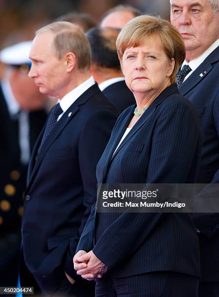 German Chancellor Angela Merkel and Russian President Vladimir Putin attend the International Ceremony at Sword Beach to commemorate the 70th...