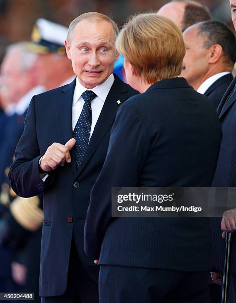 German Chancellor Angela Merkel and Russian President Vladimir Putin attend the International Ceremony at Sword Beach to commemorate the 70th...