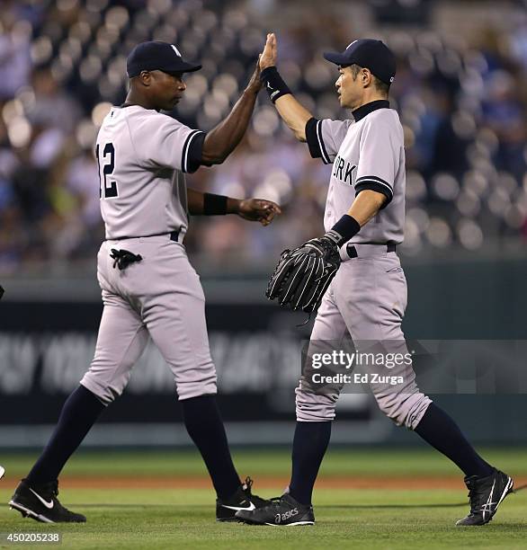 Ichiro Suzuki of the New York Yankees and Alfonso Soriano celebrate a 4-2 win over the Kansas City Royals at Kauffman Stadium on June 6, 2014 in...