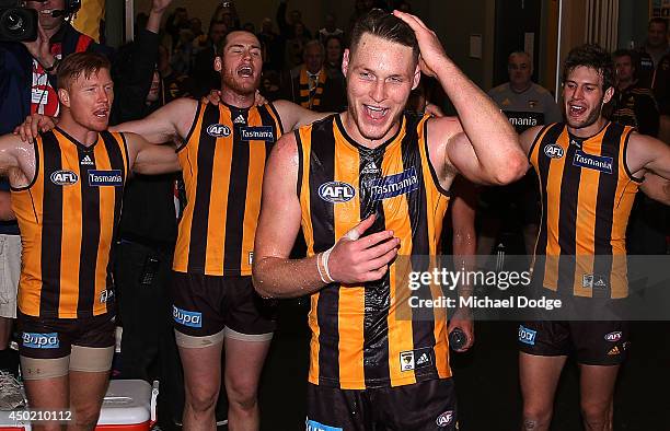 Luke Lowden of the Hawks gets doused with water as he celebrates his debut game with a win during the round 12 AFL match between the Hawthorn Hawks...