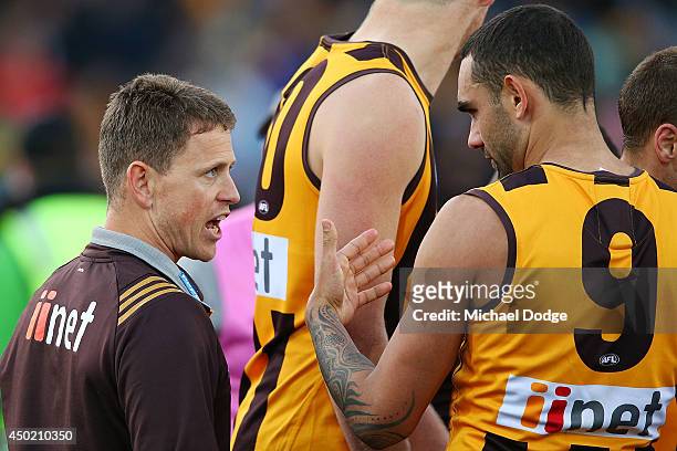 Stand-in Hawks coach Brendon Bolton speaks to Shaun Burgoyne of the Hawks during the round 12 AFL match between the Hawthorn Hawks and the West Coast...