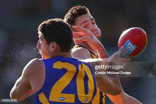 Dean Cox of the Eagles competes for the ball against Jack Gunston of the Hawks during the round 12 AFL match between the Hawthorn Hawks and the West...