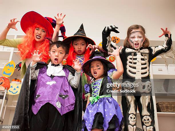 halloween celebrations - costume party stock pictures, royalty-free photos & images