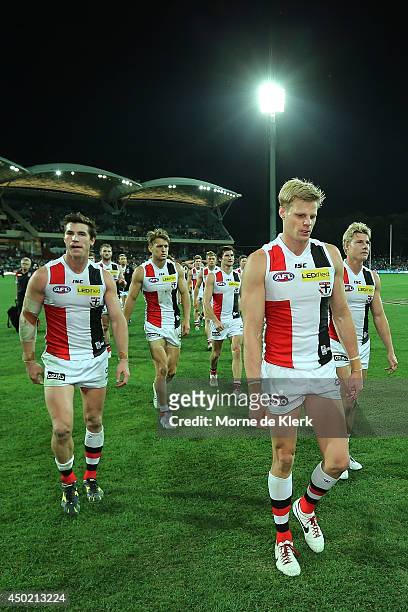 Saints players leave the field lead by their captain Nick Riewoldt after the round 12 AFL match between the Port Adelaide Power and the St Kilda...