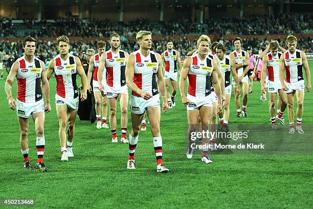 Saints players leave the field lead by their captain Nick Riewoldt after the round 12 AFL match between the Port Adelaide Power and the St Kilda...