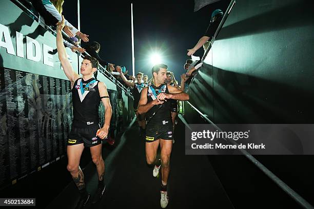 Power players leave the field after the round 12 AFL match between the Port Adelaide Power and the St Kilda Saints at Adelaide Oval on June 7, 2014...