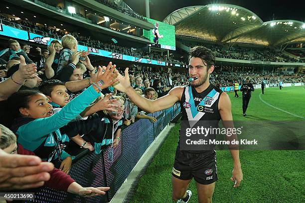 Chad Wingard of the Power celebrates with spectators after the round 12 AFL match between the Port Adelaide Power and the St Kilda Saints at Adelaide...