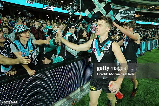 Robbie Gray of the Power celebrates with spectators after the round 12 AFL match between the Port Adelaide Power and the St Kilda Saints at Adelaide...