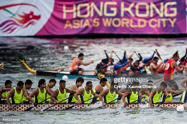 Dragon boat racers race during Hong Kong International Dragon Boat Races on June 7, 2014 in Hong Kong, Hong Kong. The dragon boat festival is also...