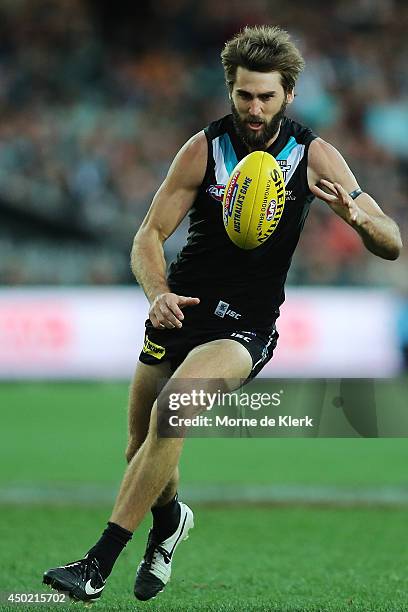 Justin Westhoff of the Power runs with the ball during the round 12 AFL match between the Port Adelaide Power and the St Kilda Saints at Adelaide...
