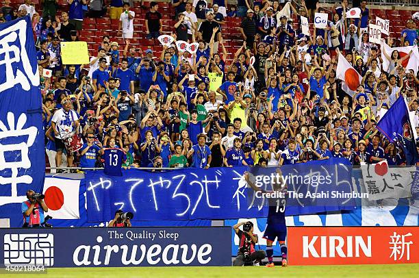 Yoshito Okubo of Japan celebrates the win with supporters after the international friendly match between Japan and Zambia at Raymond James Stadium on...