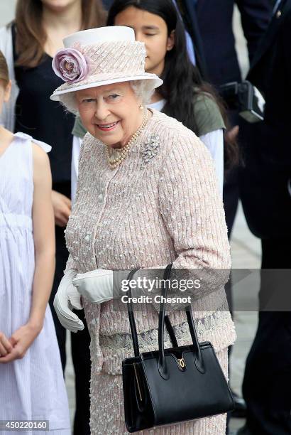 Britain's Queen Elizabeth II visits the newly renamed "Queen Elizabeth II" flower market on June 7 in Paris.