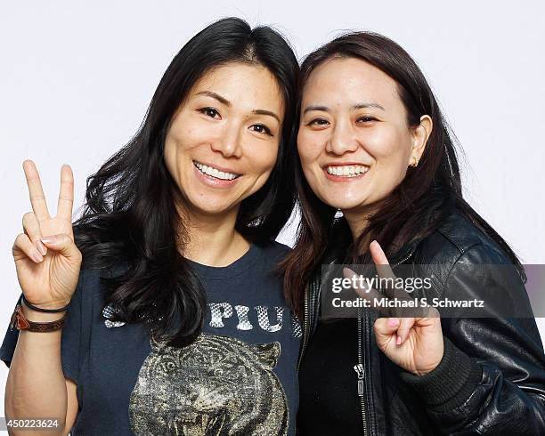 Comedian Aiko Tanaka and Julie Kang pose after Aiko's performance at The Ice House Comedy Club on June 6, 2014 in Pasadena, California.