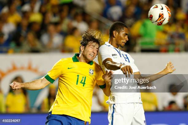 Jerry Bengtson of Honduras heads the ball from Maxwell of Brazil on November 16, 2013 during a friendly match at SunLife Stadium Stadium in Miami...