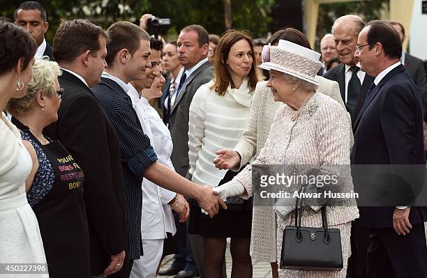 Queen Elizabeth ll, Prince Philip, Duke of Edinburgh and French President Francois Hollande meet wellwishers at the Marche aux Fleurs et aux Oiseaux...
