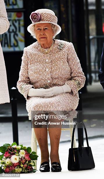 Queen Elizabeth ll sits to listen to a speech as she visits the Marche aux Fleurs et aux Oiseaux on June 7, 2014 in Paris, France.