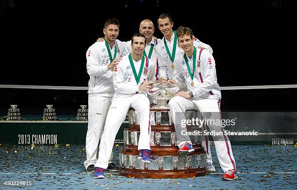 Tomas Berdych, Radek Stepanek team captain Vladimir Safarik, Lukas Rosol and Jan Hayek of Czech Republic hold the winners trophy aloft after a 3-2...