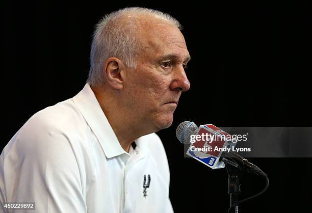 Gregg Popovich of the San Antonio Spurs speaks to the media on a practice day following Game One of the 2014 NBA Finals against the Miami Heat at the...