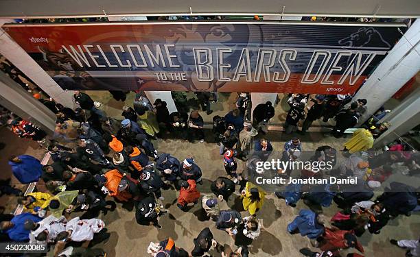 Fans wait out a weather delay of a game between the Chicago Bears and the Baltimore Ravens at Soldier Field on November 17, 2013 in Chicago, Illinois.