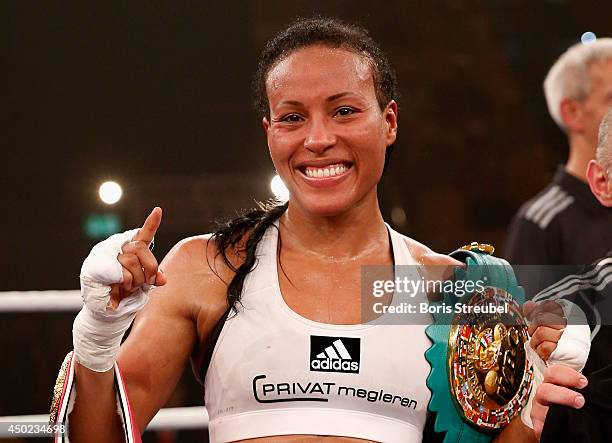 Cecilia Braekhus of Norway celebrates after winning her WBA WBC WBO female welterweight championship title fight against Jessica Balogun of Germany...