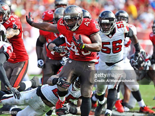 Running back Bobby Rainey of the Tampa Bay Buccaneers runs for a gain in the 2nd quarter against the Atlanta Falcons November 17, 2013 at Raymond...