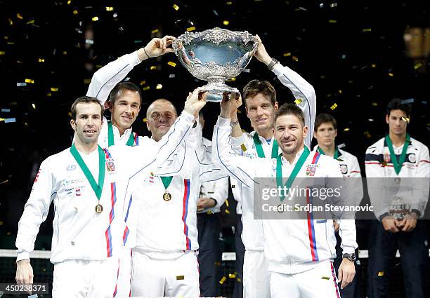 Radek Stepanek Lukas Rosol team captain Vladimir Safarik Tomas Berdych and Jan Hayek of Czech Republic hold the winners trophy aloft after a 3-2...