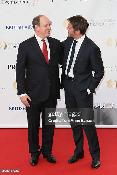 Prince Albert II of Monaco and Prince Emanuele Filiberto di Savoia attend the opening ceremony of the 54th Monte Carlo TV Festival at the Grimaldi...