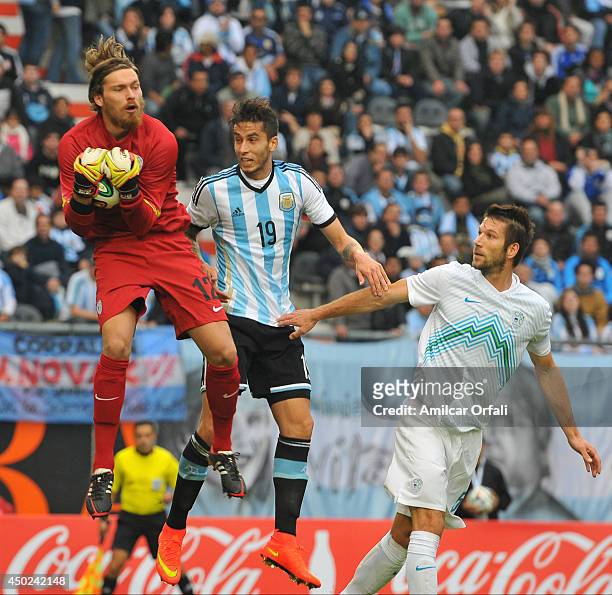 Ricardo Alvarez of Argentina jumps for the ball during a FIFA friendly match between Argentina and Slovenia at Ciudad de La Plata Stadium on June 7,...