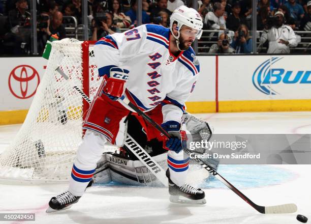 Benoit Pouliot of the New York Rangers handles the puck against the Los Angeles Kings during the first period of Game Two of the 2014 Stanley Cup...