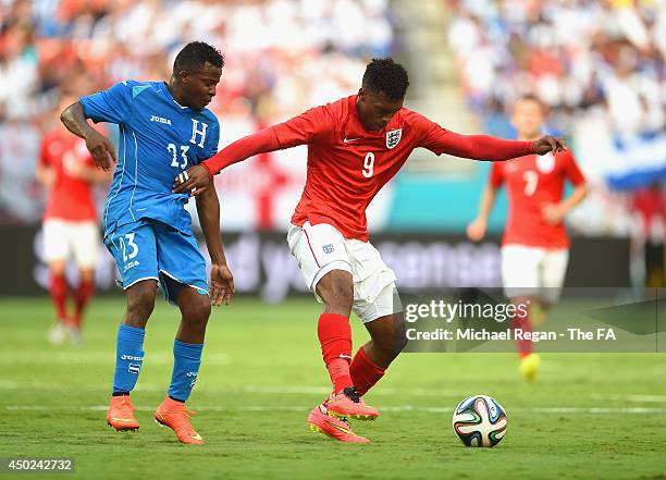 Daniel Sturridge in action with Marvin Chavez of Honduras during the International Friendly match between England and Honduras at Sun Life Stadium on...