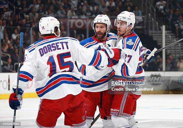 Ryan McDonagh of the New York Rangers celebrates his goal against the Los Angeles Kings with teammates Derek Dorsett and Dominic Moore during the...