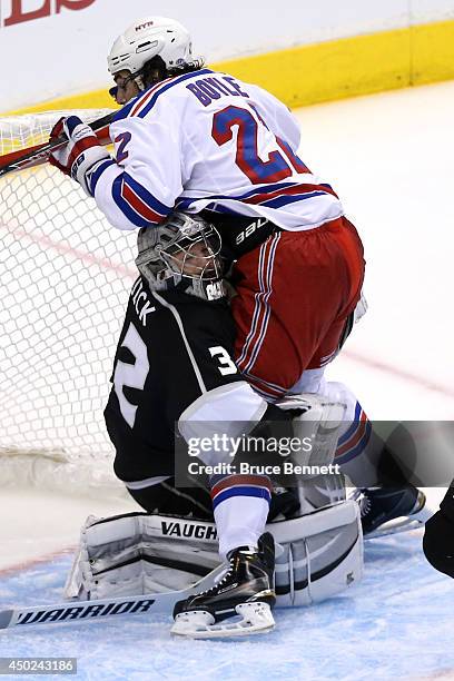 Brian Boyle of the New York Rangers runs into goaltender Jonathan Quick of the Los Angeles Kings in the first period during Game Two of the 2014 NHL...