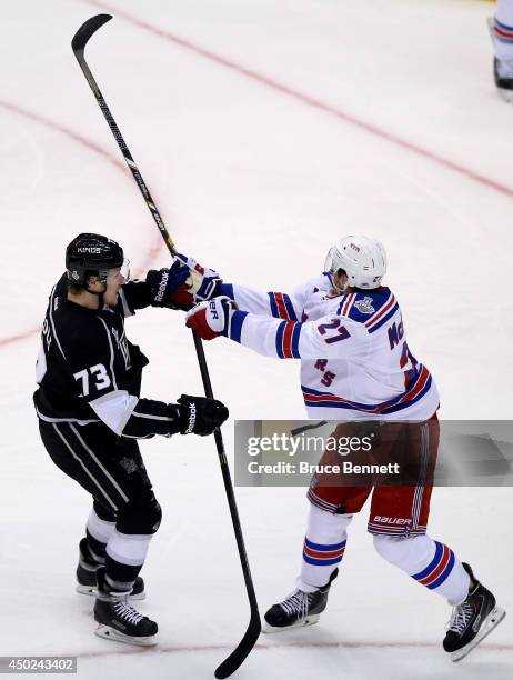 Tyler Toffoli of the Los Angeles Kings checks Ryan McDonagh of the New York Rangers in the first period during Game Two of the 2014 NHL Stanley Cup...