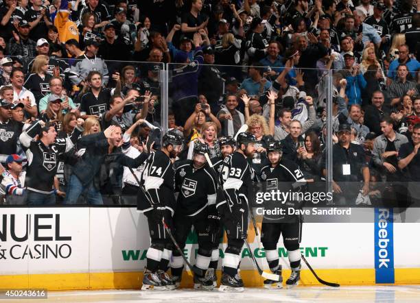 Jarret Stoll of the Los Angeles Kings celebrates his goal in the second period with teammates during Game Two of the 2014 Stanley Cup Final against...