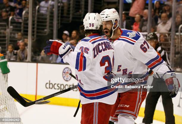 Benoit Pouliot and Mats Zuccarello of the New York Rangers celebrate Zuccarello's goal in the first period of Game Two of the 2014 Stanley Cup Final...