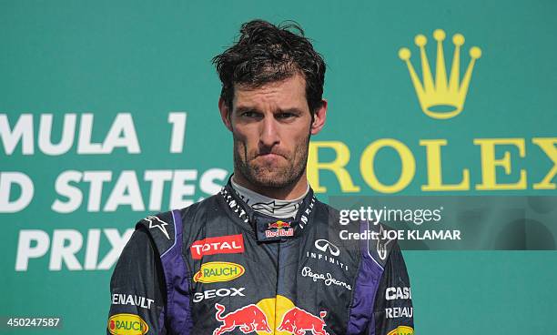 Infiniti Red Bull driver Mark Weber reacts on the podium as he takes 3rd place during the United States Formula One Grand Prix at Circuit of The...