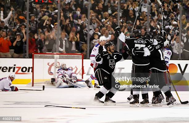 Dustin Brown of the Los Angeles Kings celebrates after he scored the overtime goal to defeat the New York Rangers 5-4 in Game Two of the 2014 Stanley...