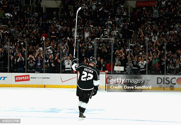 Dustin Brown of the Los Angeles Kings acknowledges the crowd after his overtime goal to defeat the New York Rangers 5-4 in Game Two of the 2014...