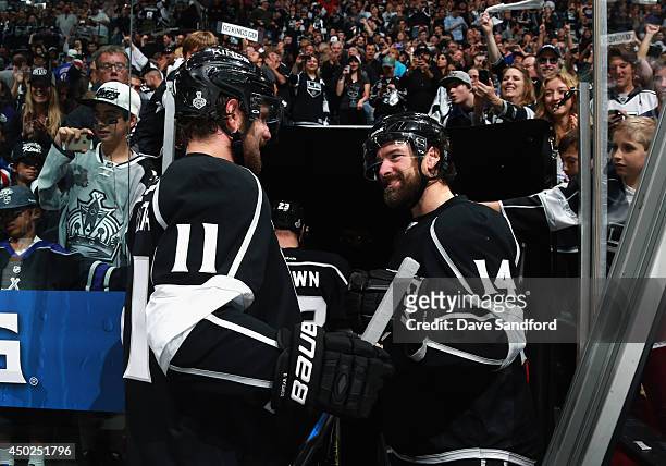 Justin Williams of the Los Angeles Kings congratulates Anze Kopitar after the Kings defeated the New York Rangers 5-4 with an overtime goal scored by...