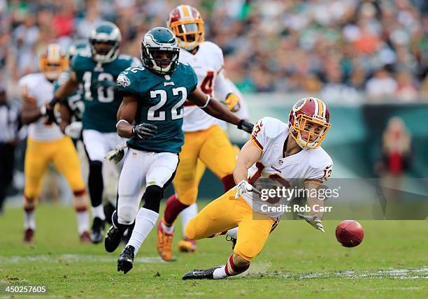 Nick Williams of the Washington Redskins drops and then recovers a second half punt while cornerback Brandon Boykin of the Philadelphia Eagles moves...