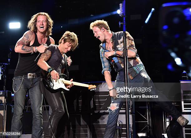 Tyler Hubbard, Keith Urban, and Brian Kelley perform onstage at the 2014 CMA Festival on June 7, 2014 in Nashville, Tennessee.