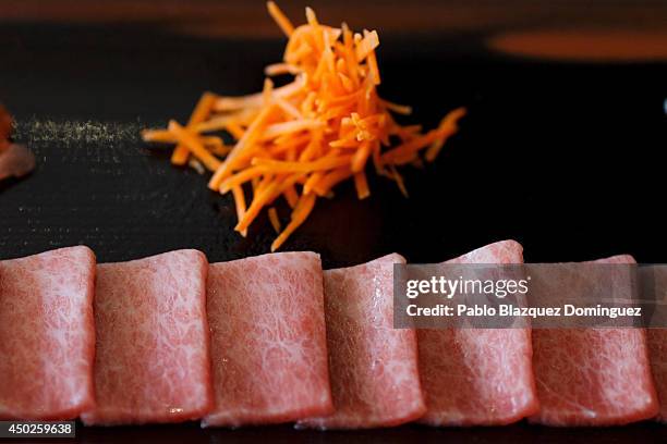 Dish of tuna sashimi stands on a table before being served inside El Campero Restaurant during the end of the Almadraba tuna fishing season on June...