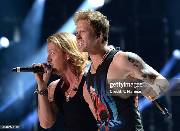 Tyler Hubbard and Brian Kelley of Florida Georgia Line perform during the 2014 CMA Festival at LP Field on June 7, 2014 in Nashville, Tennessee.