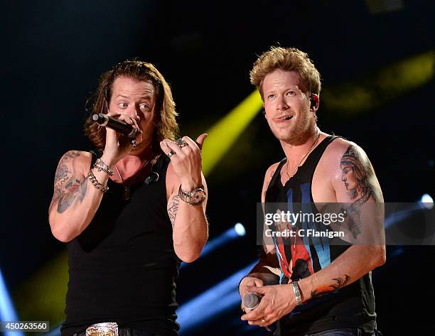 Tyler Hubbard and Brian Kelley of Florida Georgia Line perform during the 2014 CMA Festival at LP Field on June 7, 2014 in Nashville, Tennessee.