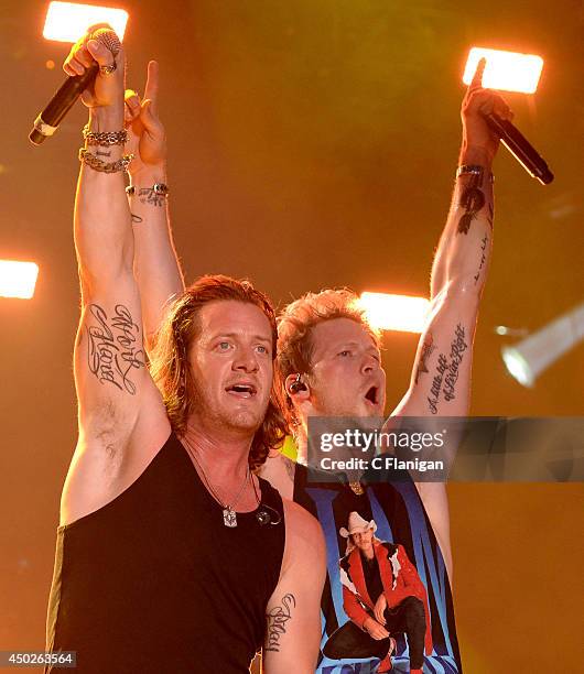 Tyler Hubbard and Brian Kelley of Florida Georgia Line perform during the 2014 CMA Festival at LP Field on June 7, 2014 in Nashville, Tennessee.